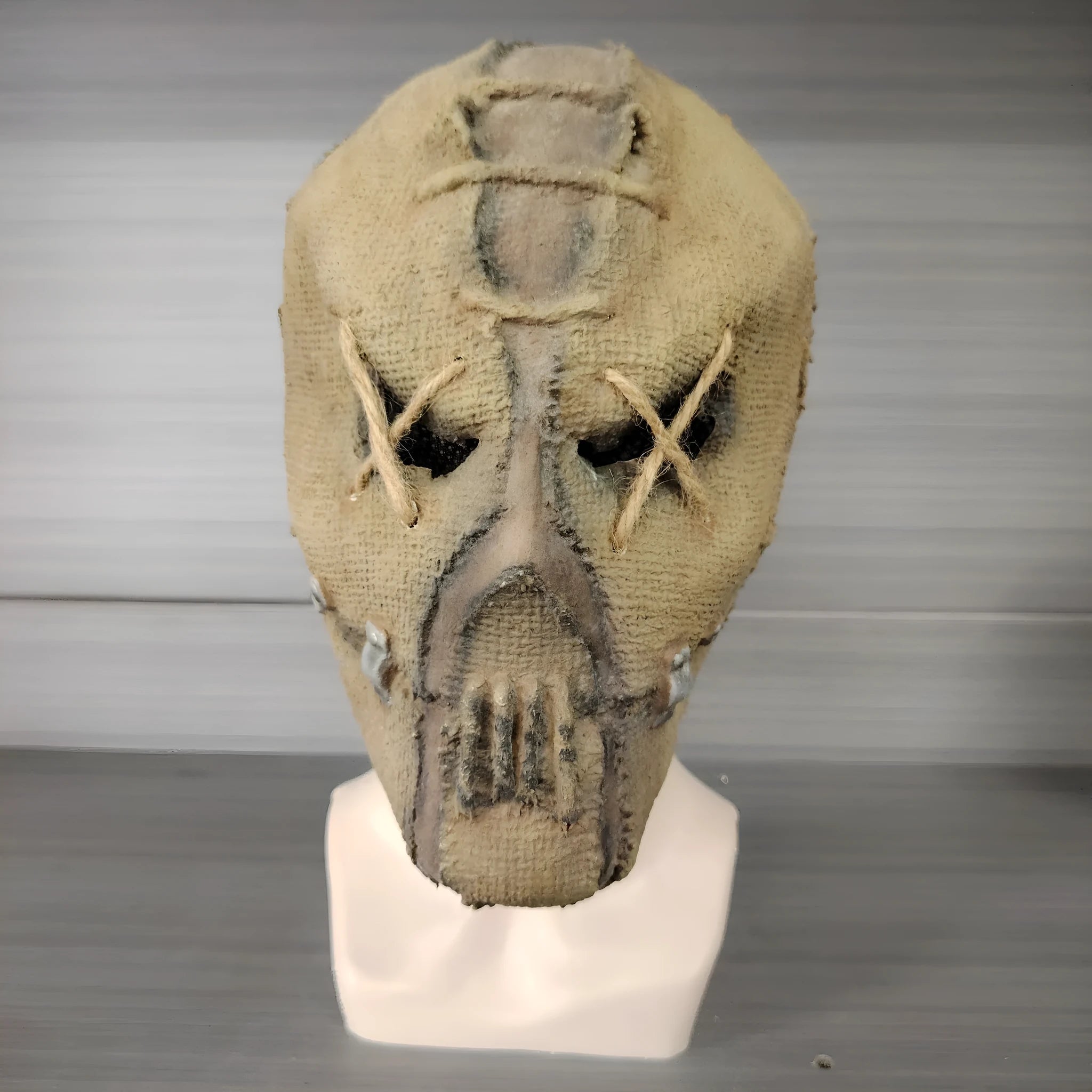 Latex Halloween horror mask with scar skull design, shown as a full head cover.