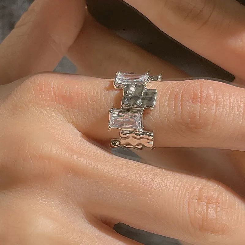 Silver open ring with cross zircon stones and geometric design