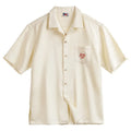 Men's light apricot Cuban collar shirt with bamboo plant pattern detail