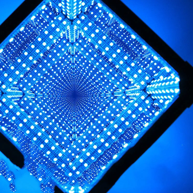 Thousand Mirrors 3D magic cube RGB LED lamp in black finish with remote control on desk