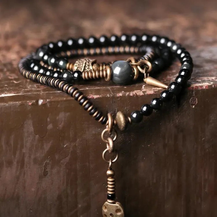 Black geometric layered bead bracelet with retro colourful design elements