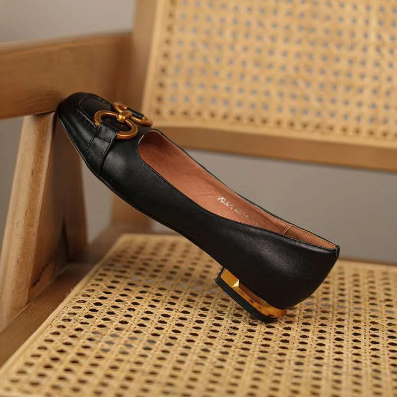 Women's black Wanwan Lei style Mary Jane pumps with square toe and super high heel on a rubber sole.