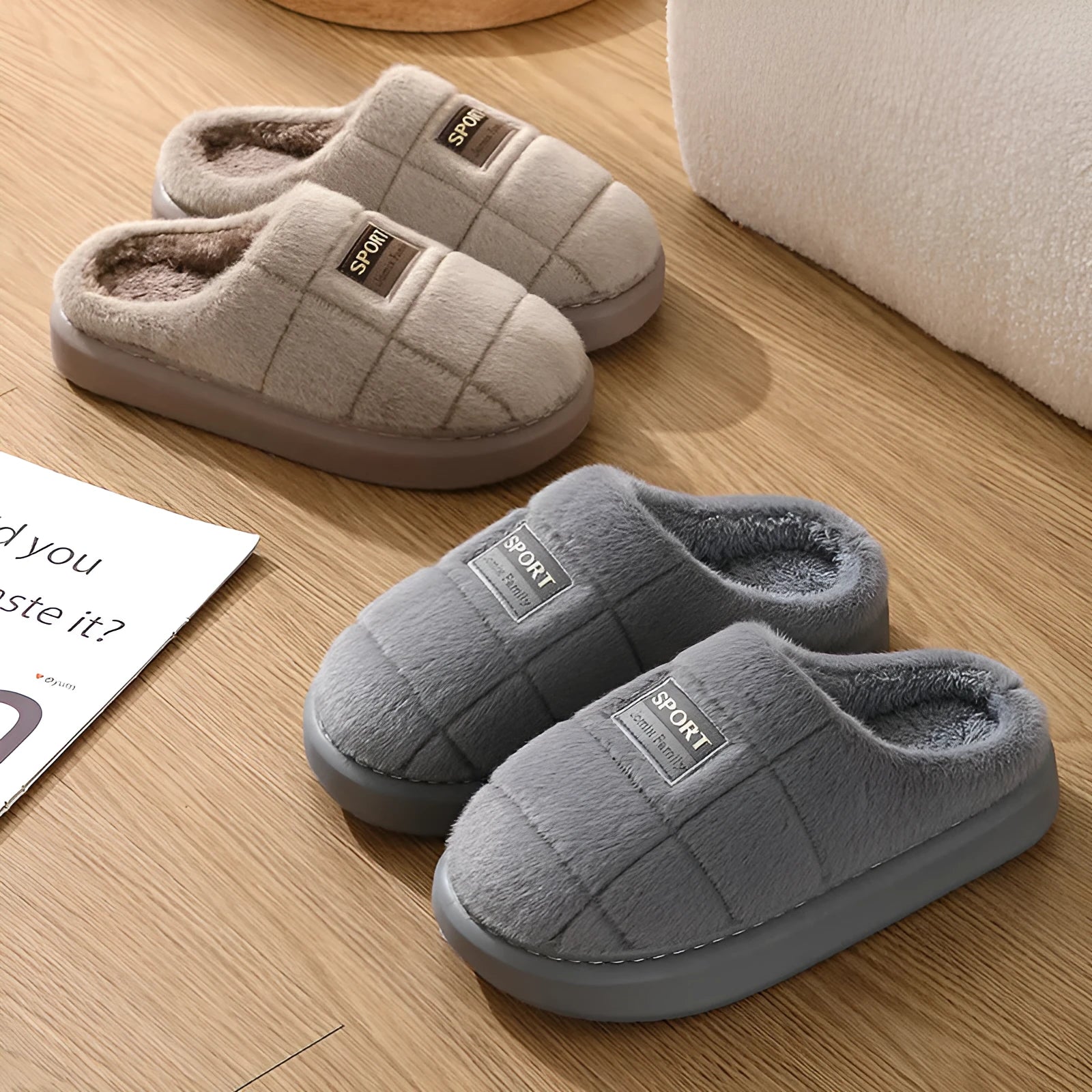 Men's grey and brown plaid rabbit hair winter slippers with a thick sole on a wooden floor.