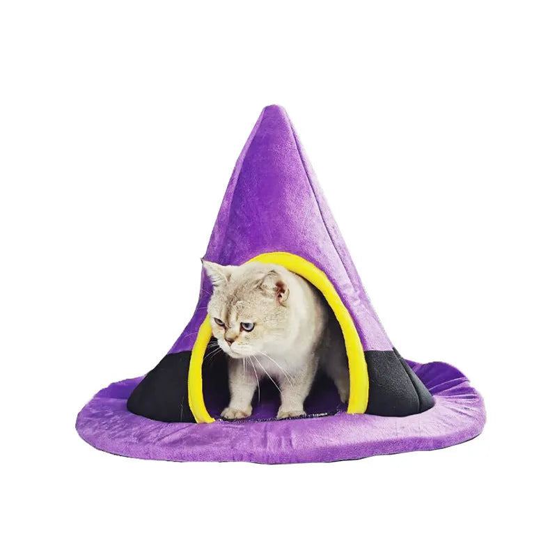 Purple Halloween witch hat-shaped fabric cat bed on a white background.