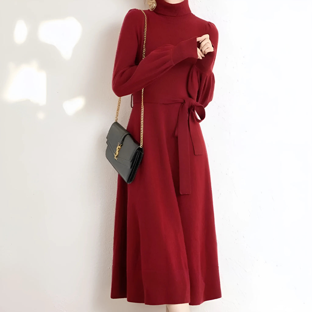 Rose red loose fit turtleneck knitted dress with long sleeves and a midi-length skirt.