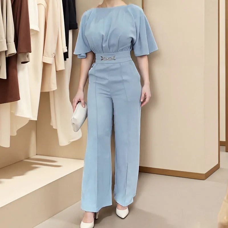 Blue men's polyester casual suit set with long sleeves and trousers on a hanger.