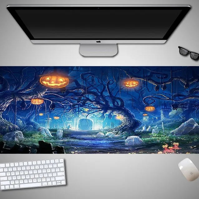 Oversized Halloween-themed rubber cloth mouse pad on a desk, showing non-slip base and large surface area.