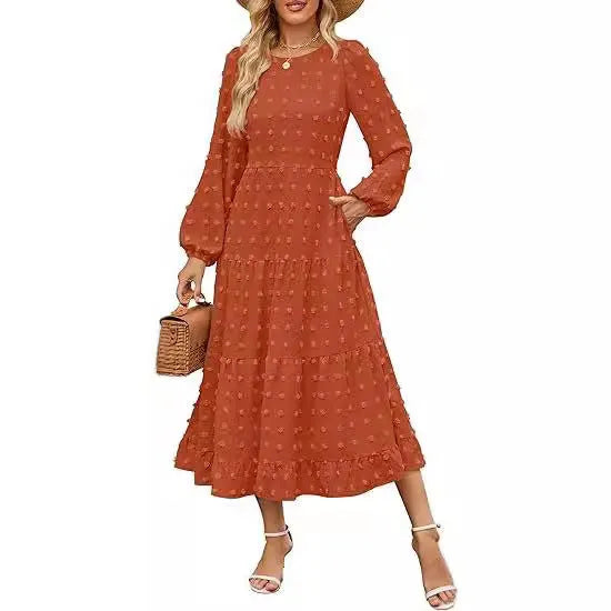 Women's beige high-waist long sleeve dress with ruffled sleeves on a hanger.