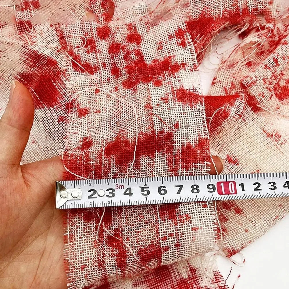 Bloody red polyester Halloween bandage roll showing 8cm width and textured surface for costume use.
