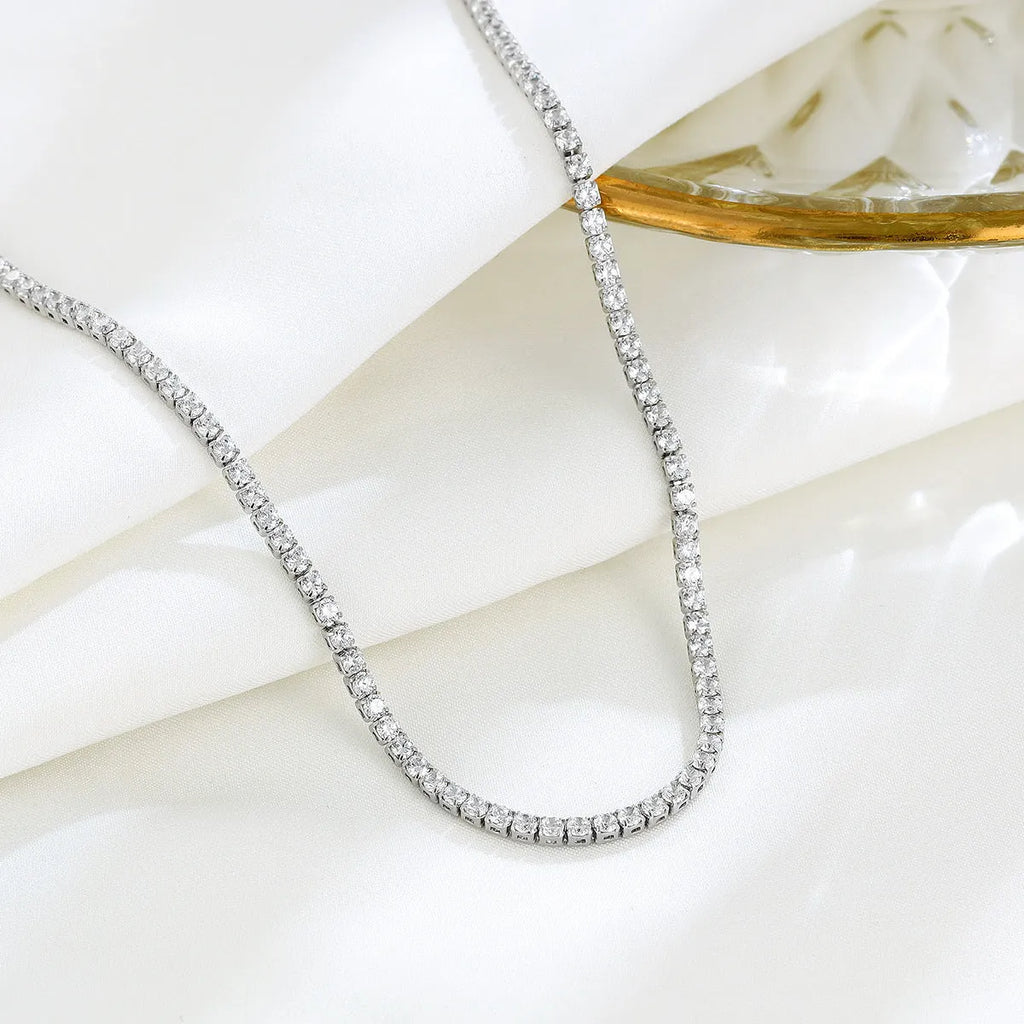 Women's sterling silver necklace with round design elements and diamond polishing treatment in silver colour