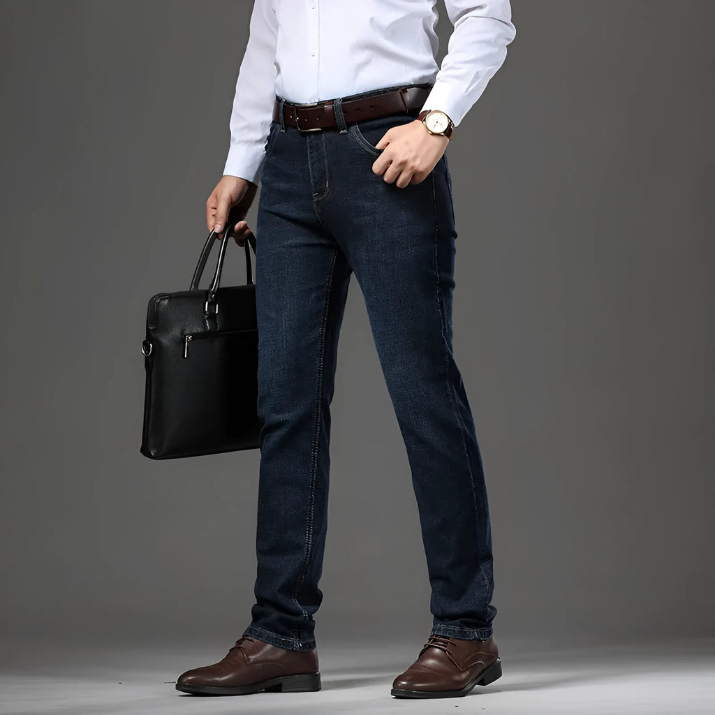 Women's straight-leg stretch jeans in mid-waist style with zip fly, available in black and blue