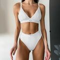 Women's black embroidered contrast binding bikini set made from polyester fabric.