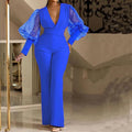 Red mesh stitch jumpsuit with elastic waist and wide legs on hanger