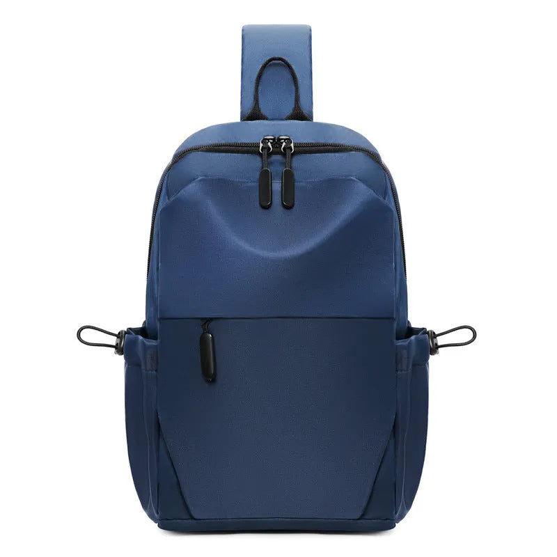 Grey men's waterproof chest bag shown on shoulder, displaying its 33cm height and spacious main compartment.