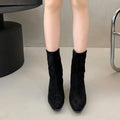 Brown women's square toe ankle boots with a side zip and a stiletto kitten heel on a waterproof platform sole.