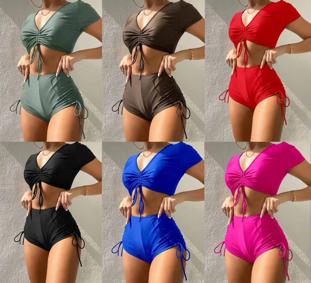 Women's dark green lace-up bow swimsuit top and shorts set for swimming.