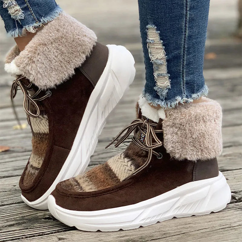 Women's beige lace-up snow boots with suede upper and thick rubber sole on white background
