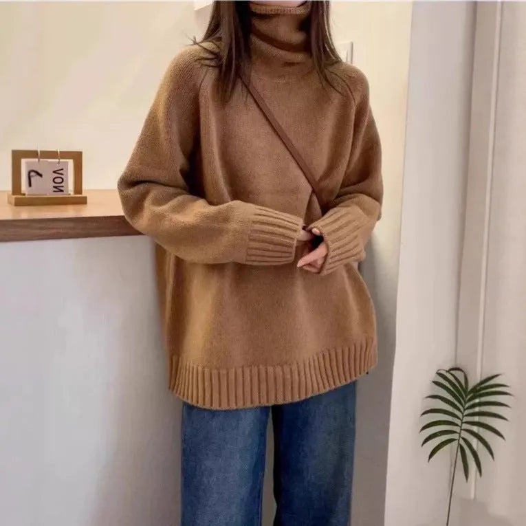 Women's loose turtleneck sweater with a thick curling pile collar in a solid colour