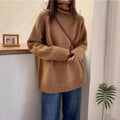 Women's loose turtleneck sweater with a thick curling pile collar in a solid colour