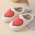 Women's plush home slippers with cartoon love print and non-slip PVC sole
