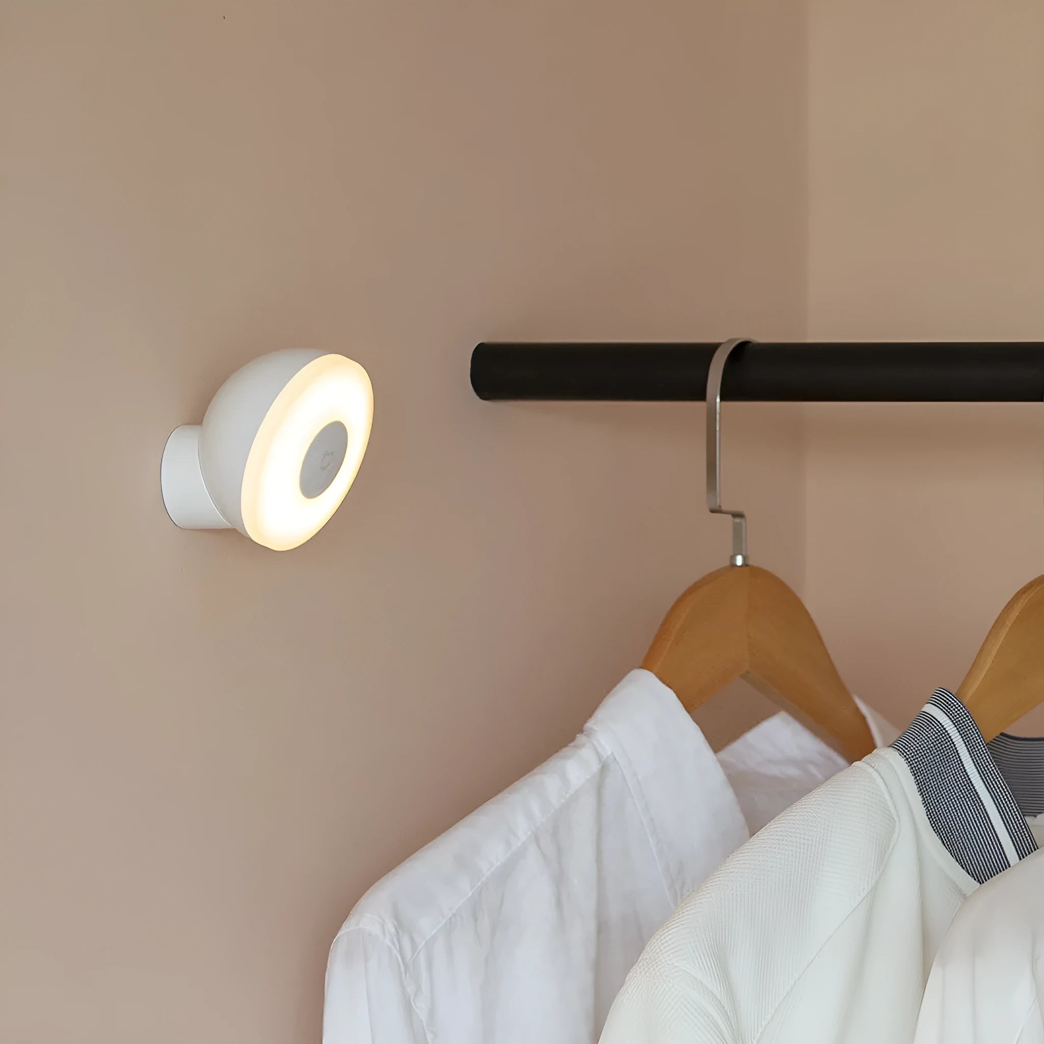 White cube-shaped Mijia bedside night light with motion sensor and Bluetooth on a wooden table.