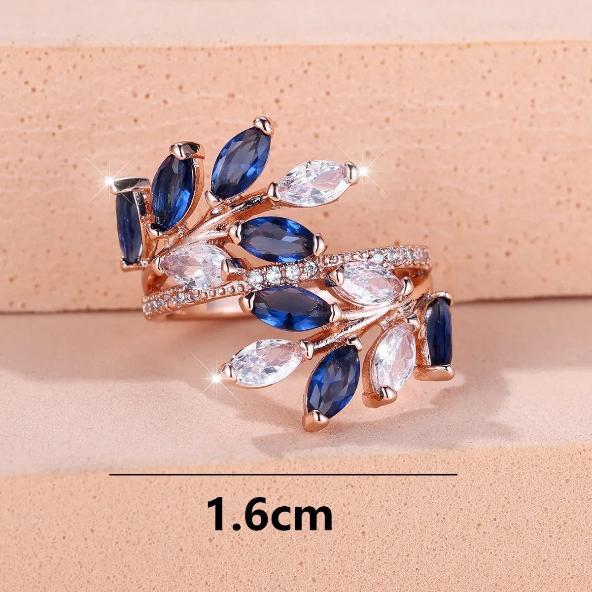 Adjustable horse eye design leaf ring in copper with zircon crystals, shown in a rose gold finish