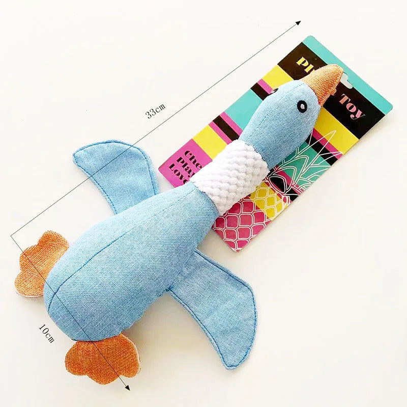 Blue, green or grey duck-shaped plush dog toy with two squeakers.