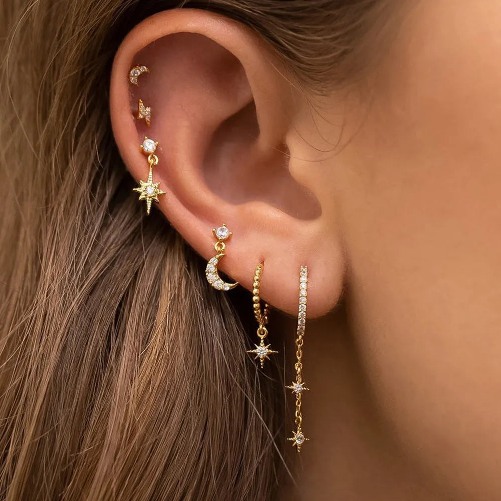 Gold colour XINGX chain tassel earrings set with six pieces showing zircon stud details
