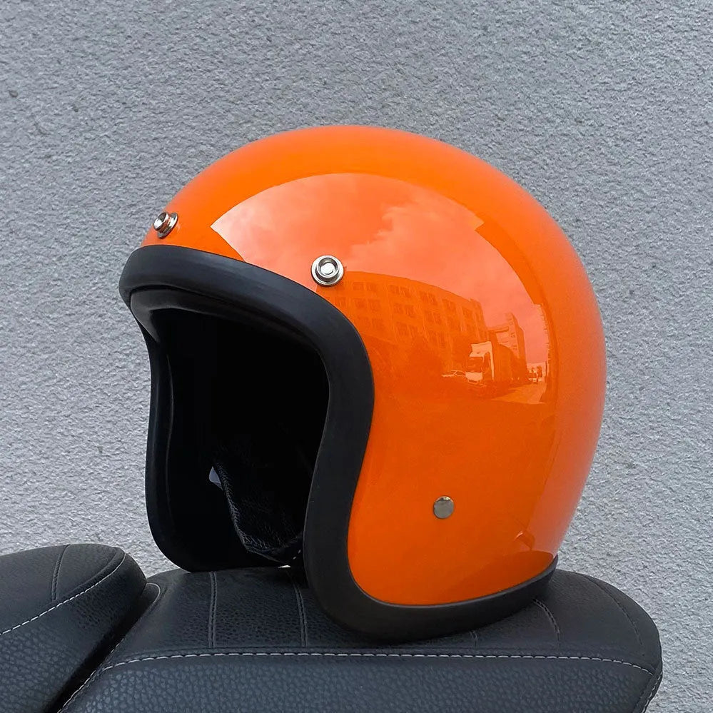Glass fibre retro half motorcycle helmet shown in various colours including cement gray and matte black options