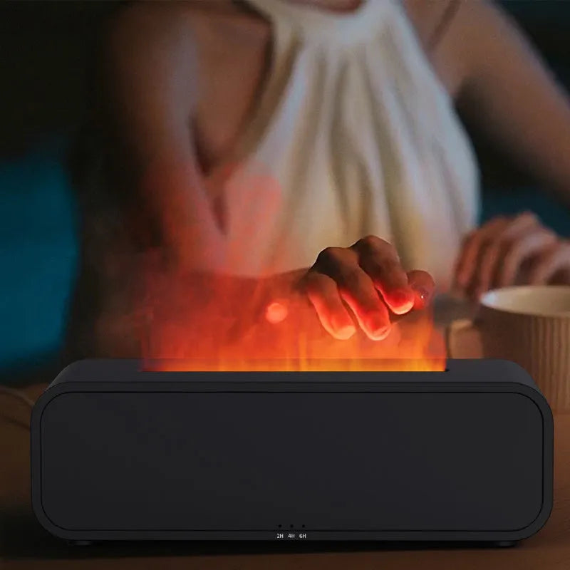 White aroma diffuser with colour-changing lights on a wooden table next to its remote control.
