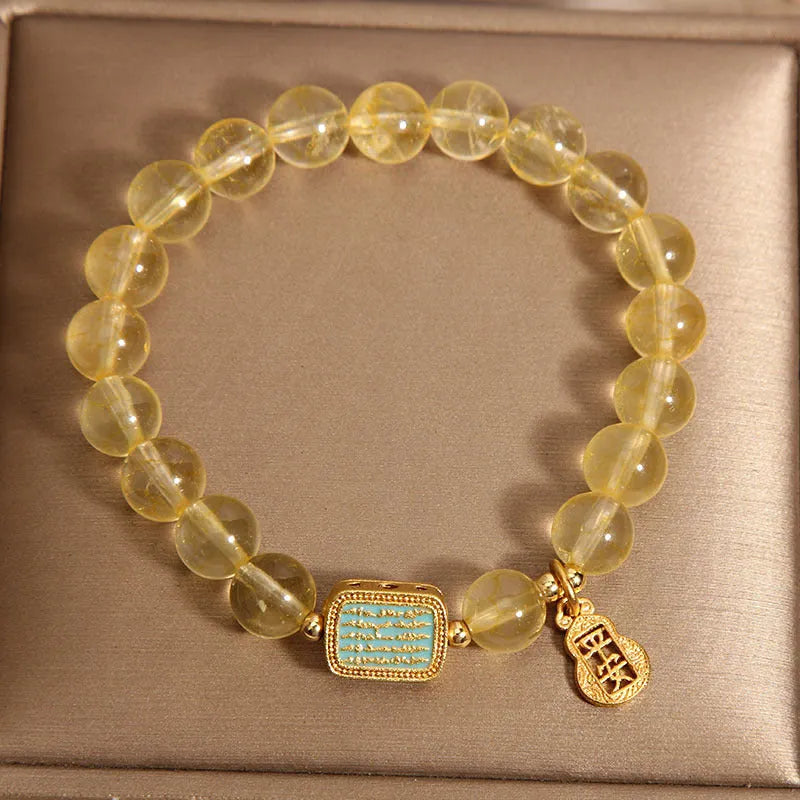 Women's natural yellow citrine crystal bracelet with decorative rhinestone elements