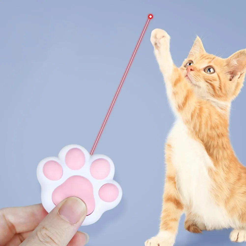 Pink and black USB-rechargeable infrared cat teaser toy with keychain loop.