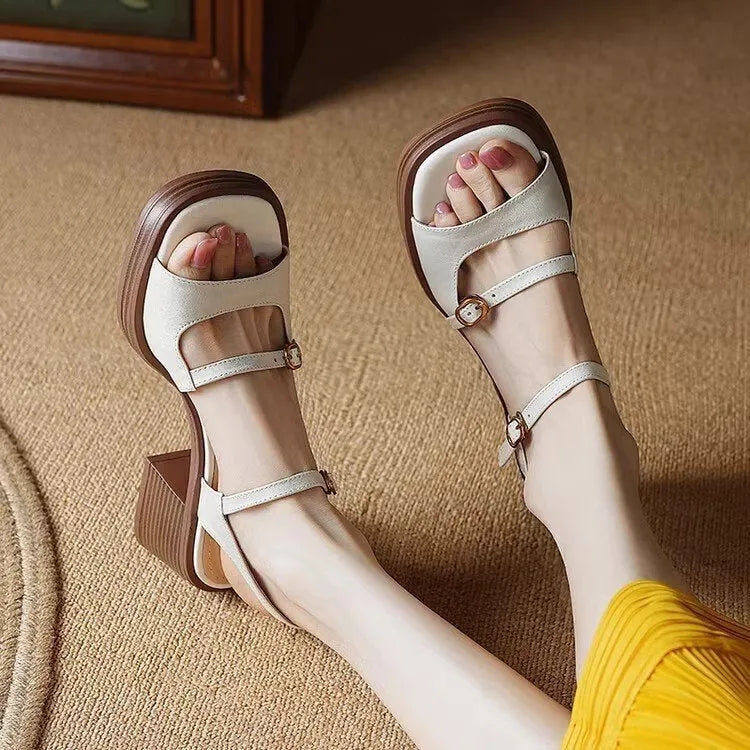 Women's open toe square toe retro platform sandals in milky white colour on a neutral background.
