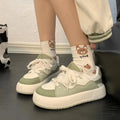 Green women's casual shoes with mesh upper and lining, flat heel and round toe design