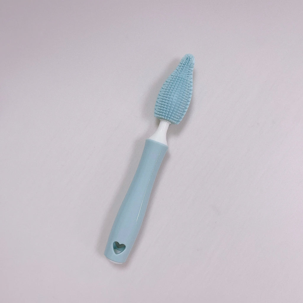 Baby bottle brush set with silicone bristles and a small straw cleaning brush in pink, blue, and yellow colours.