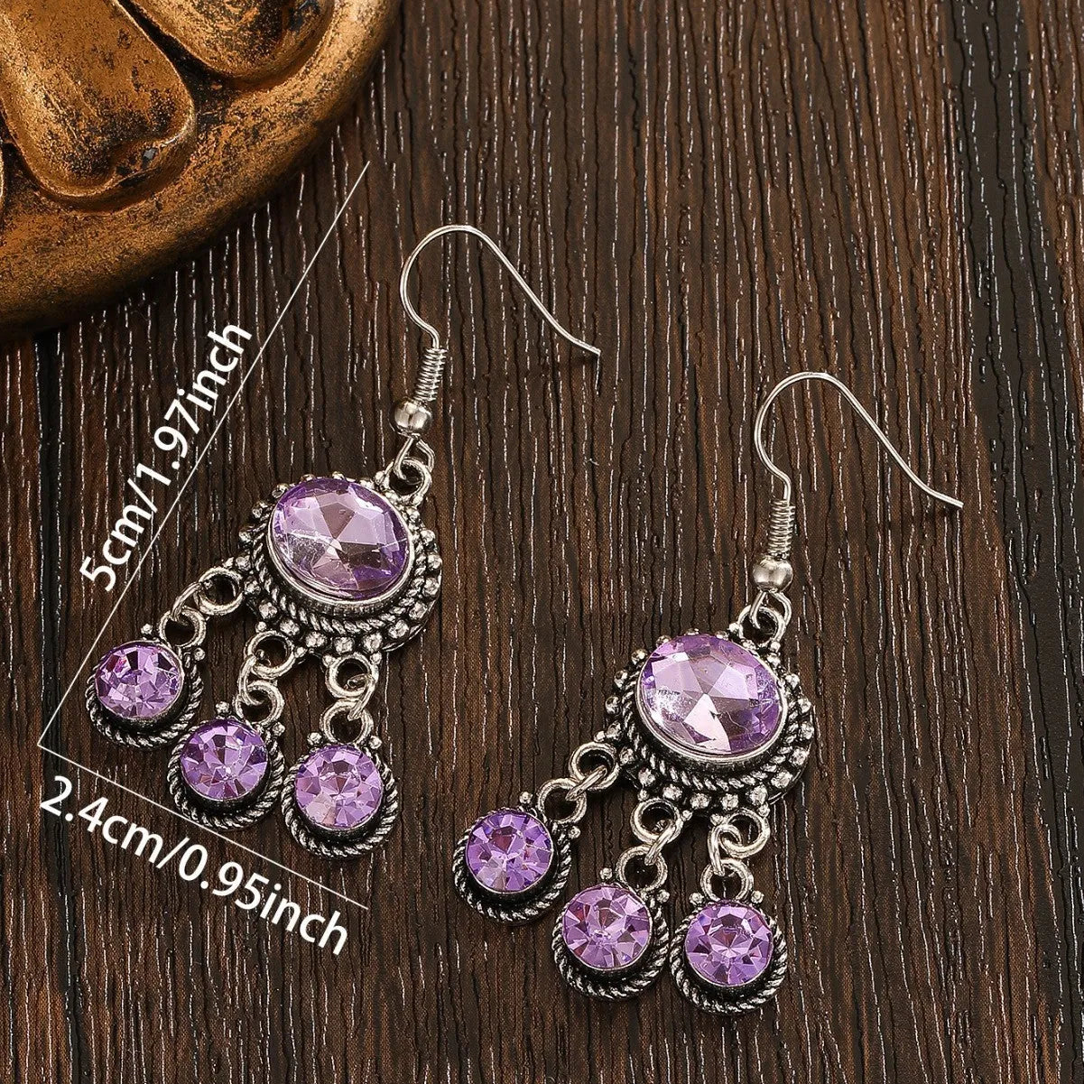 Long tassel alloy earrings in Dark Violet colour with hook fitting, hanging against a light background