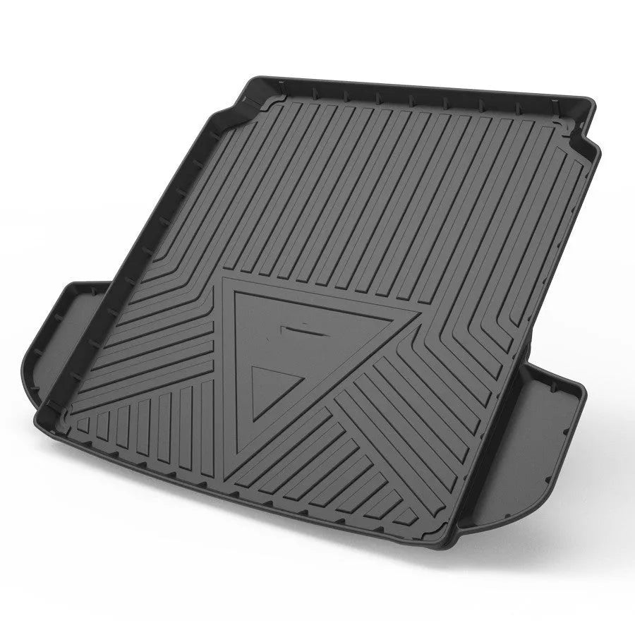 Black car boot liner with carbon fibre pattern texture, laid flat showing its tailored shape.