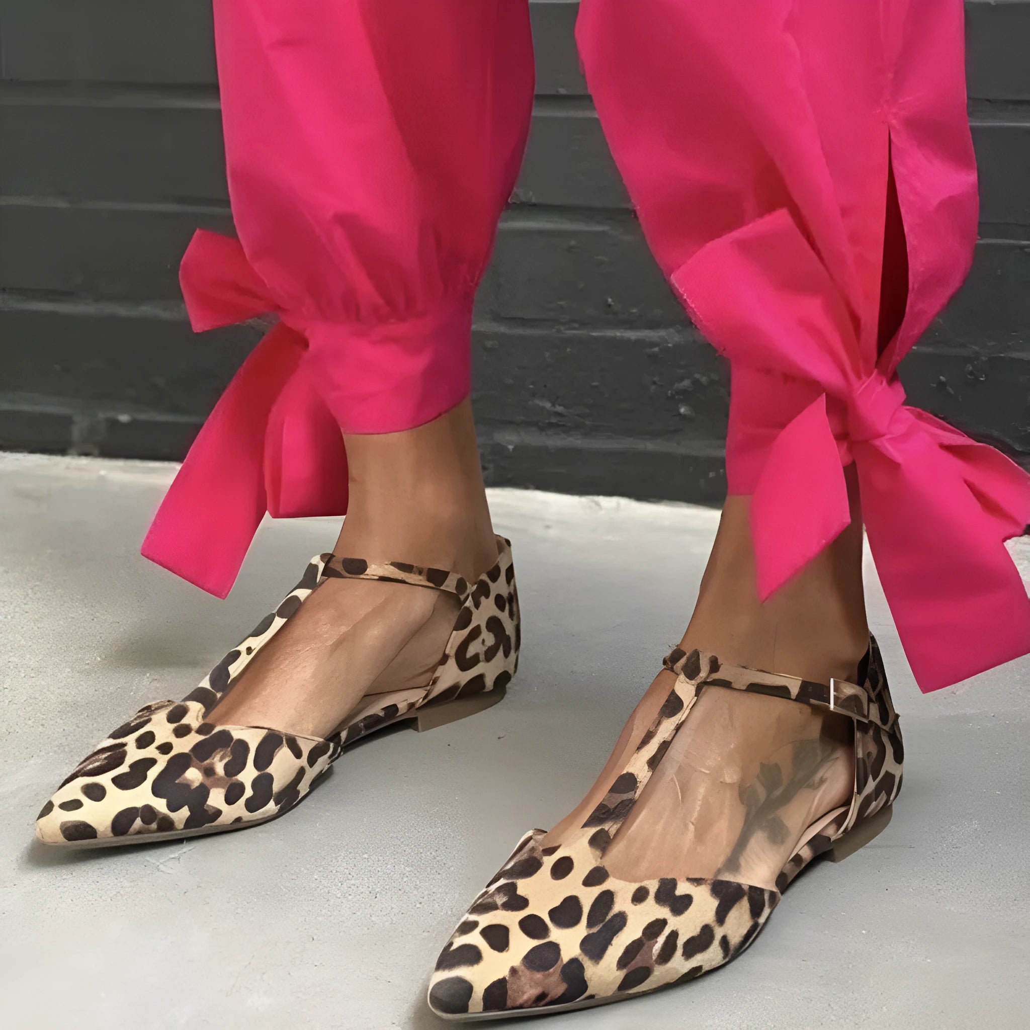 Women's leopard print pointed toe pumps with a low chunky heel and a cross shoulder strap.