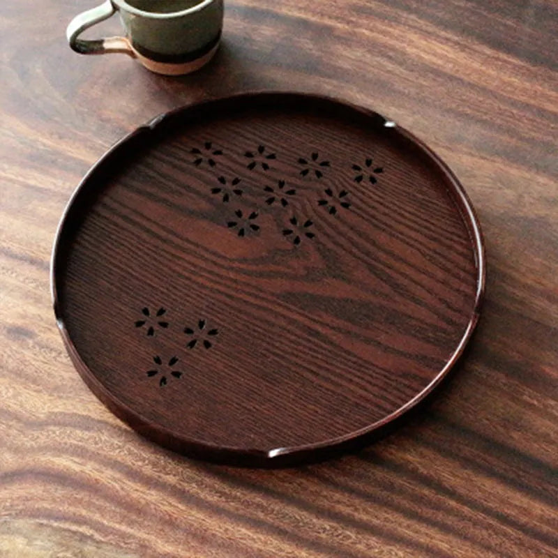 Wooden shallow plate with hollow cherry blossom pattern, 30cm long, for serving desserts indoors.