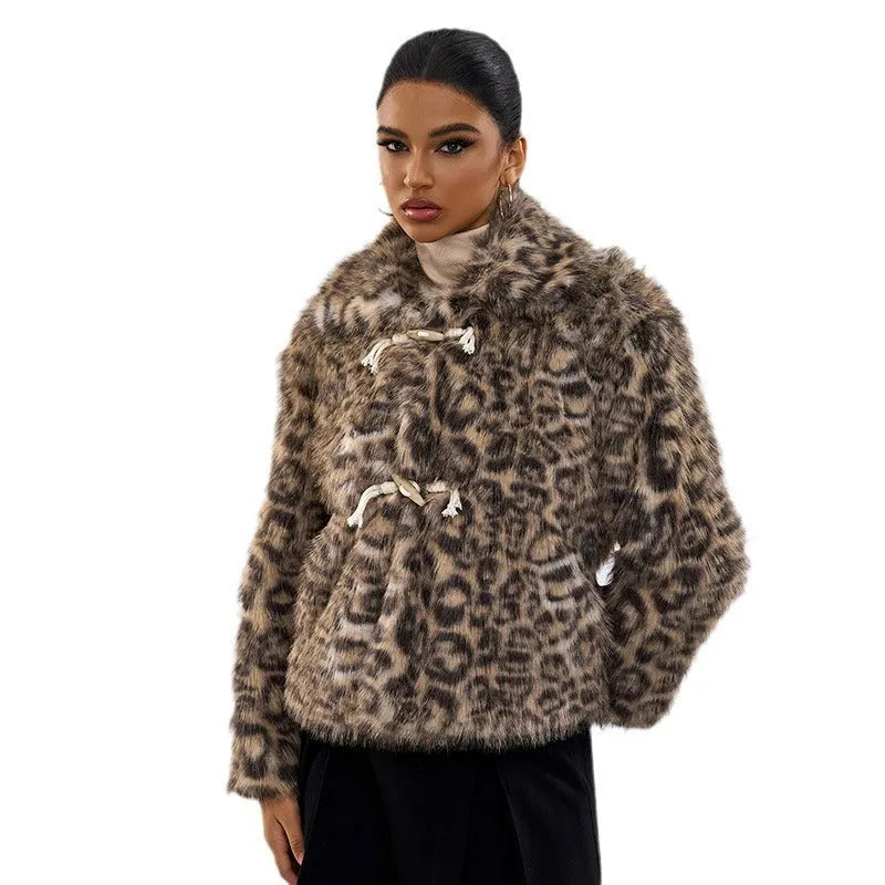 Women's leopard print coat with metallic buckle detail on lapel, regular sleeves, polyester construction