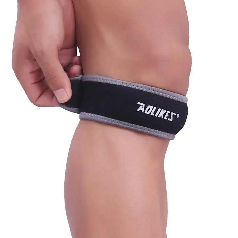 Black and grey patellar retinaculum knee brace for sports