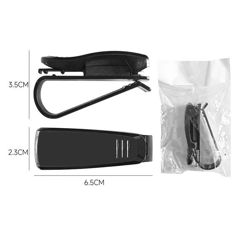 Black plastic car sun visor clip for holding glasses and cards, shown next to a ruler showing 6.5 cm length.