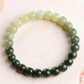 Natural Hetian Jade bracelet with water gradient colour and polished beads in unisex casual style.