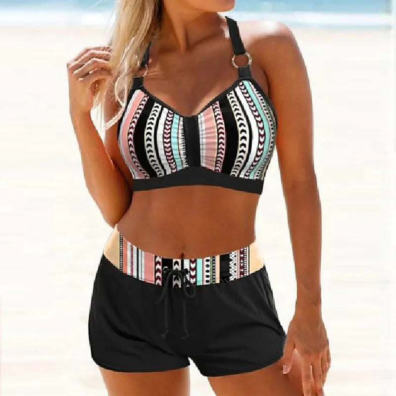 Women's navy blue and print two-piece polyester bikini swimsuit showing front design