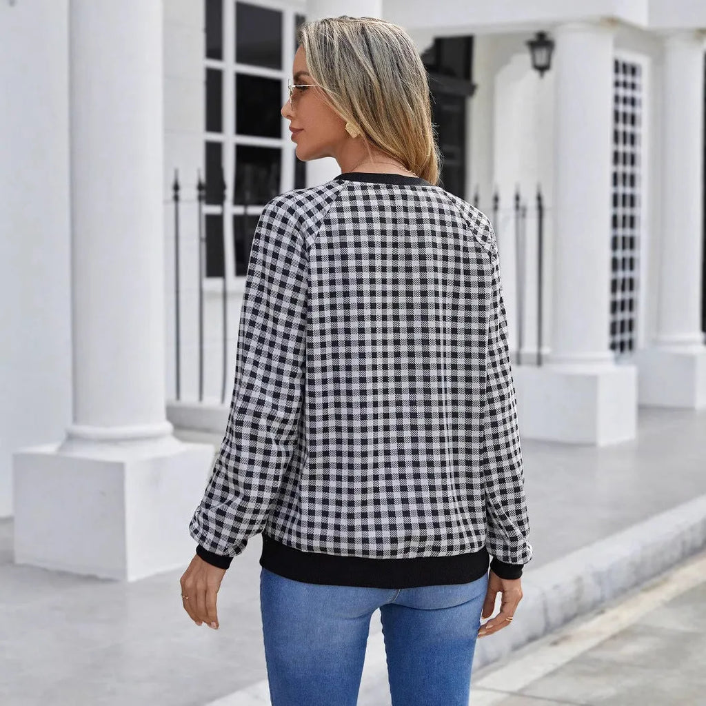 Black long sleeve pullover sweater with a printed Japanese plaid pattern