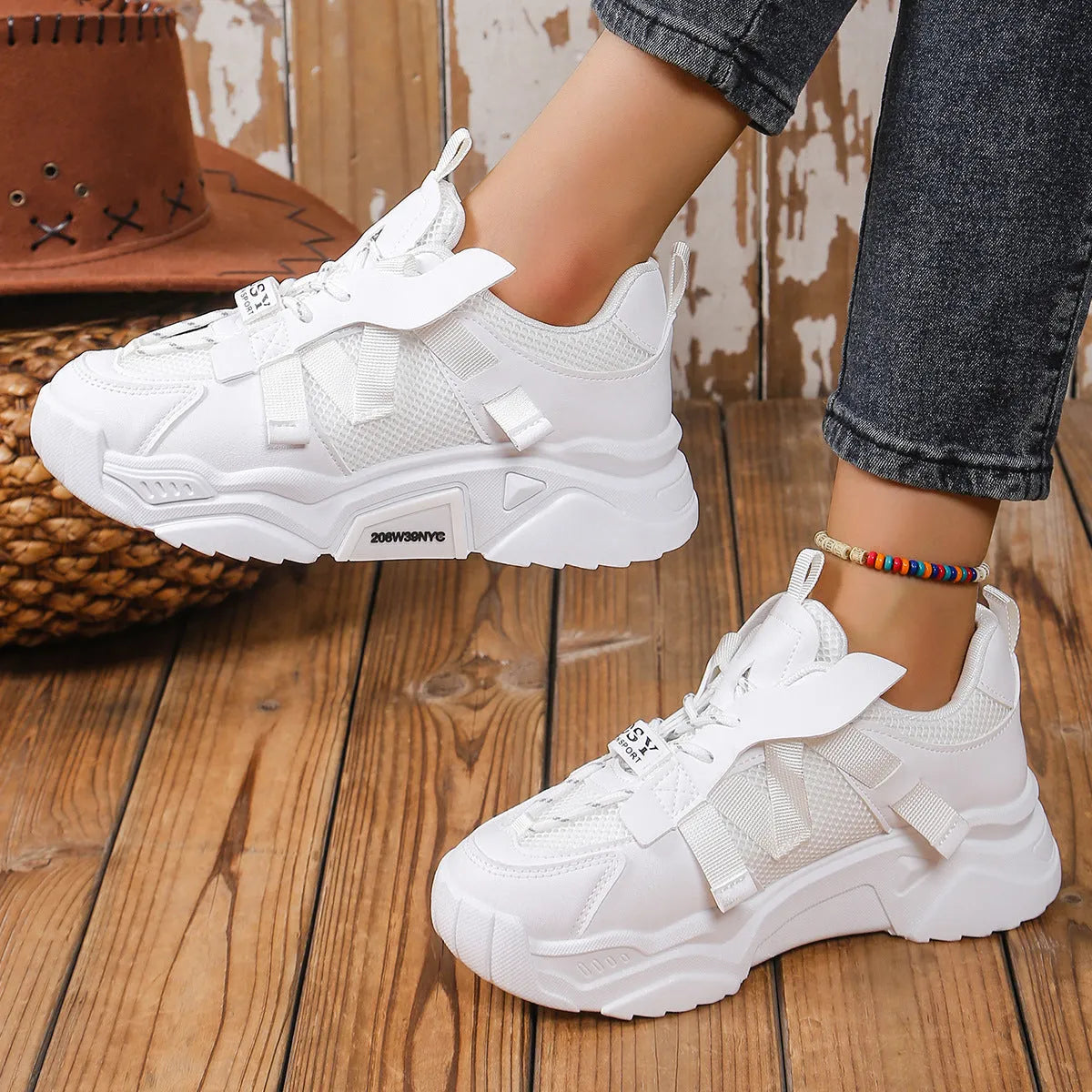 Women's platform mesh sports shoes in animal pattern design showing height increase sole and front lace-up closure