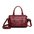 Large capacity vintage messenger bag in horizontal square shape, shown in available colours: blue, gray, camel, red, black, brown.