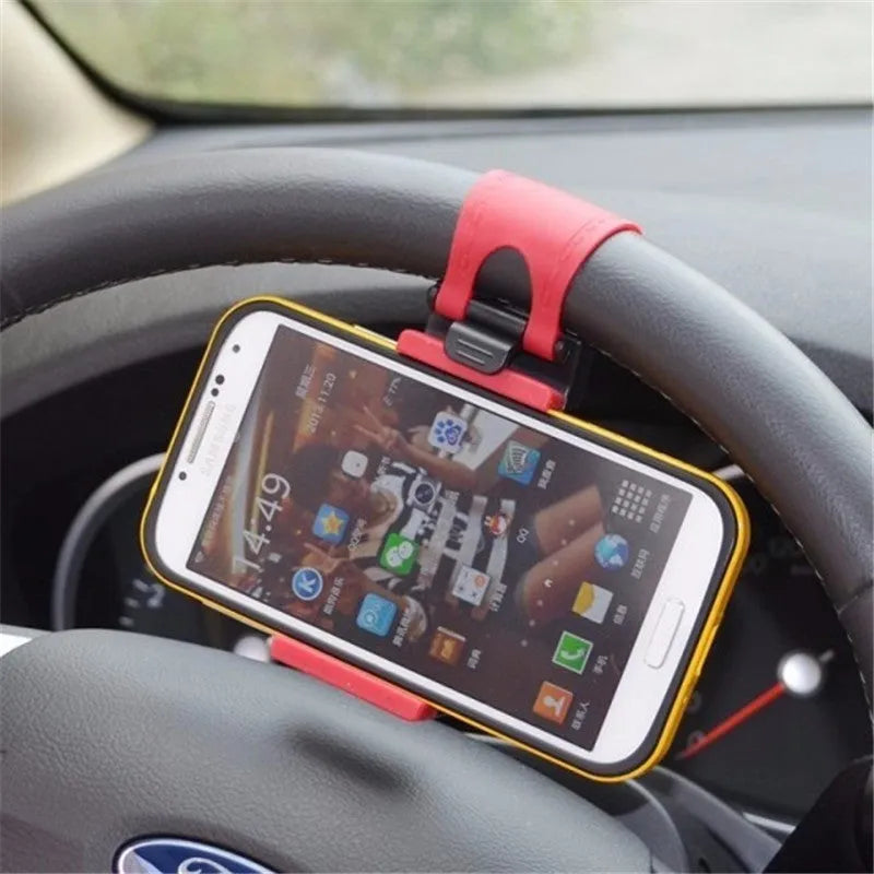Black steering wheel phone clip holder mounted with smartphone showing navigation display