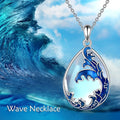 Blue alloy pendant necklace with heart design elements on included chain