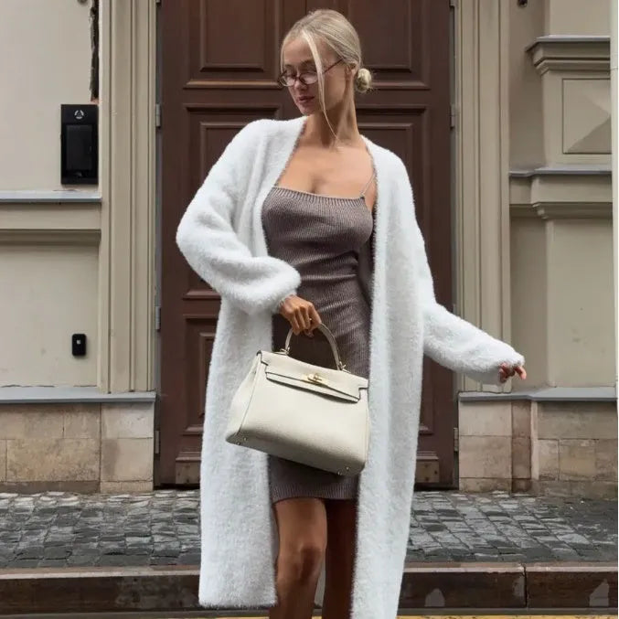Women's white knitted cardigan jacket with extended length and loose fit